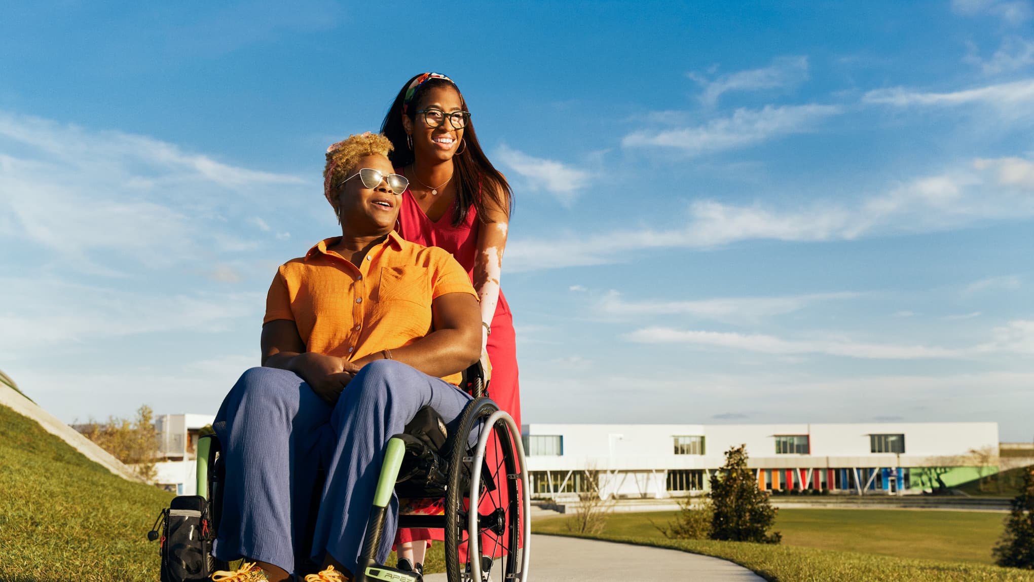 Friends walking through a park