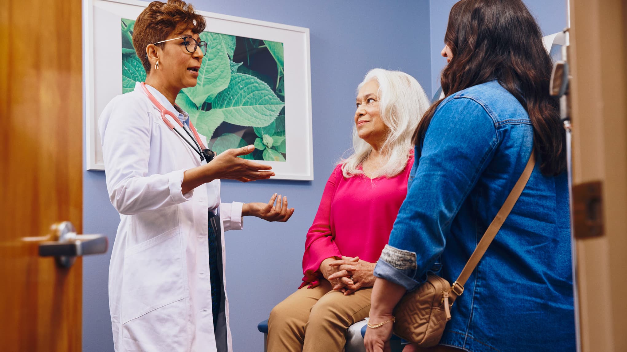 Women talking at a doctors' office